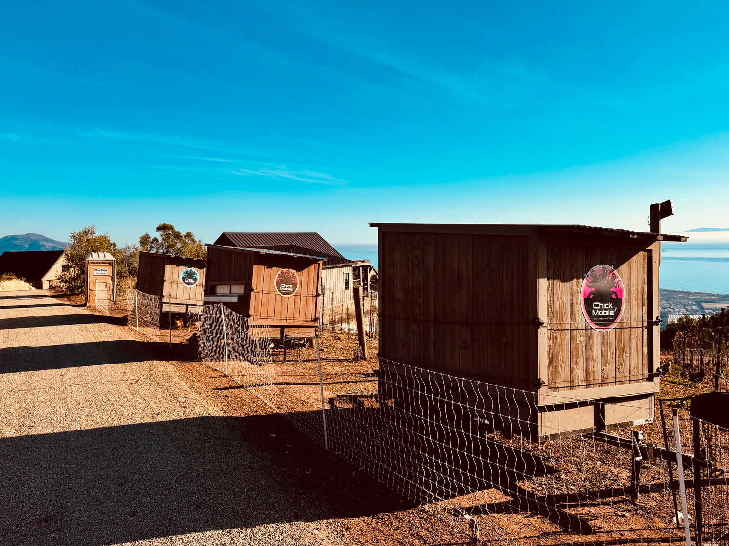 Mobile chicken coops that house our pasture raised chickens in our regeneratively farmed fields at Wanderment Farms