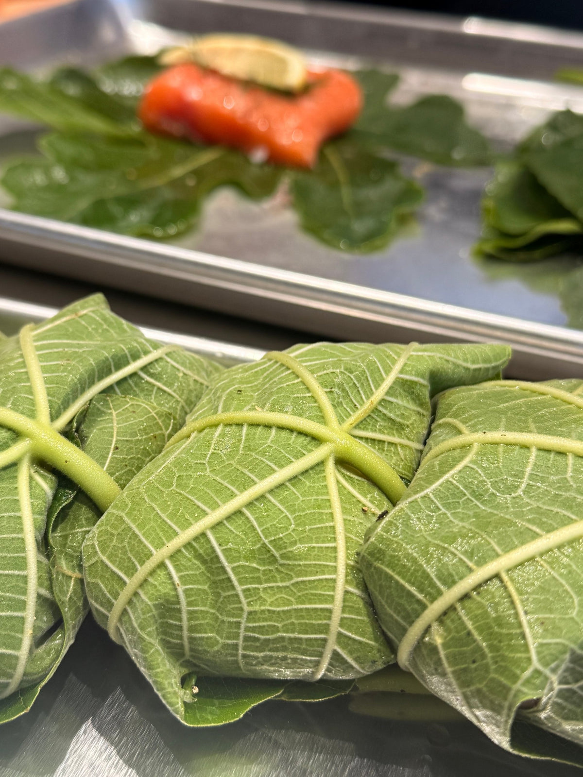 Salmon wrapped in fig leaves, ready for the oven